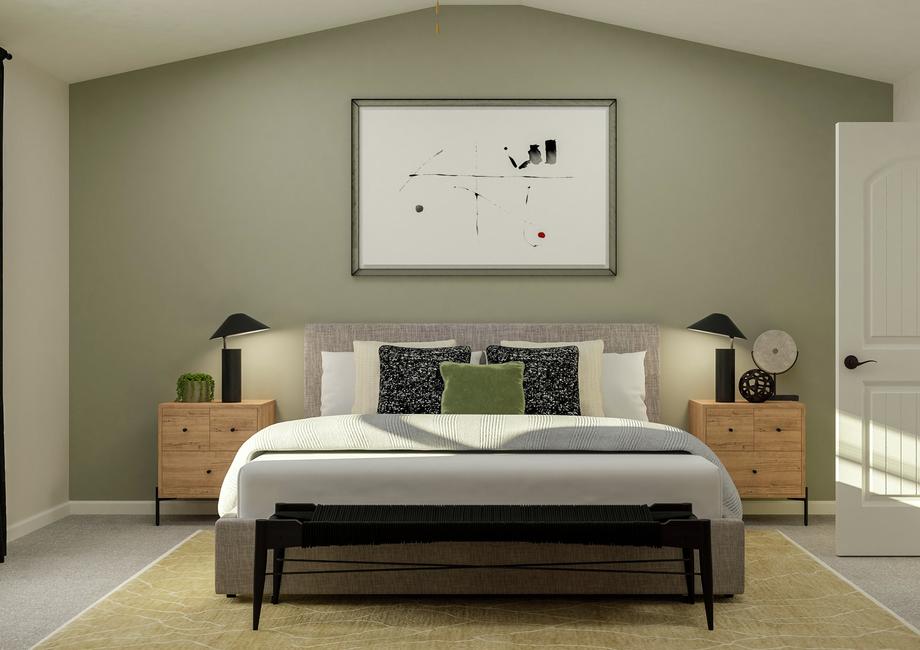 Rendering of the spacious master suite in  the Avery floor plan. The room has a vaulted ceiling and carpeted flooring  and has been furnished with a bed, nightstands and a bench.