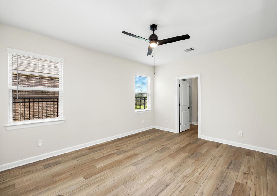 The master bedroom has luxurious vinyl plank flooring.