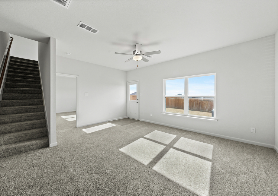 The family room has a large window that lets in great, natural light.