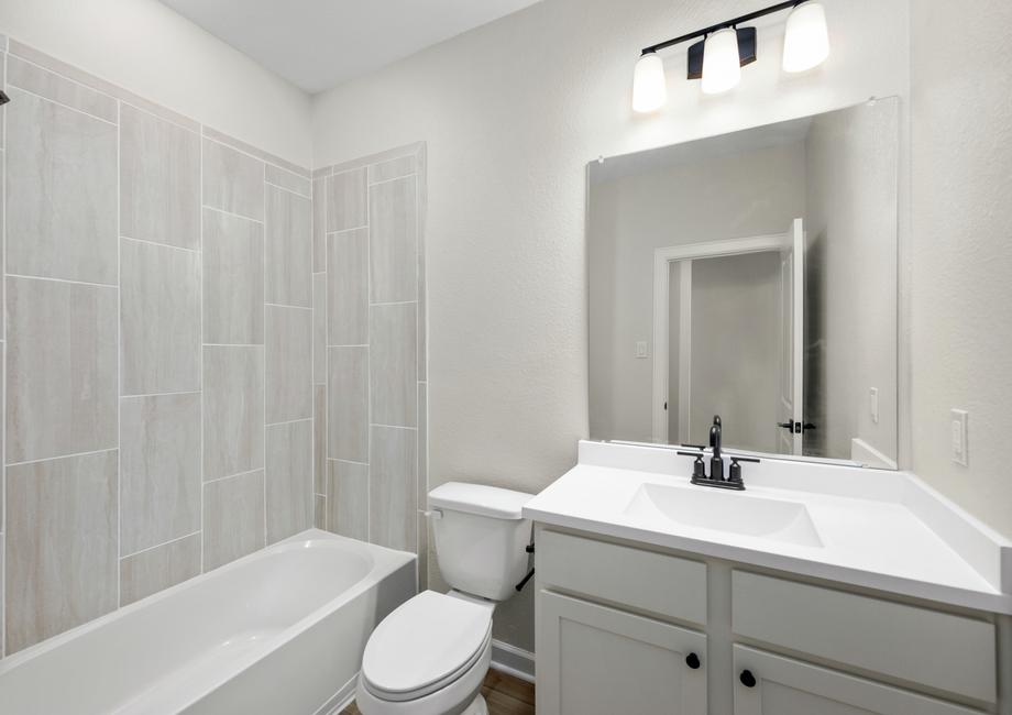 The secondary bathrooms offer a ton of storage options.