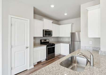The kitchen of the Chatfield has sprawling granite countertops.