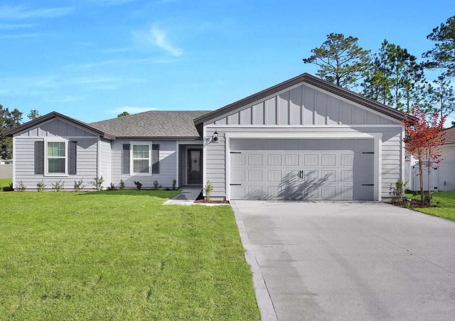 This home has a 2-car garage and professional landscaping.