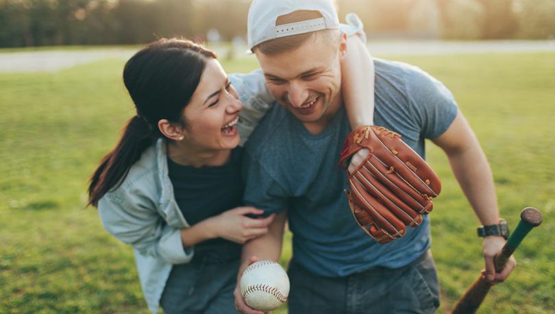 Couple playing baseball.