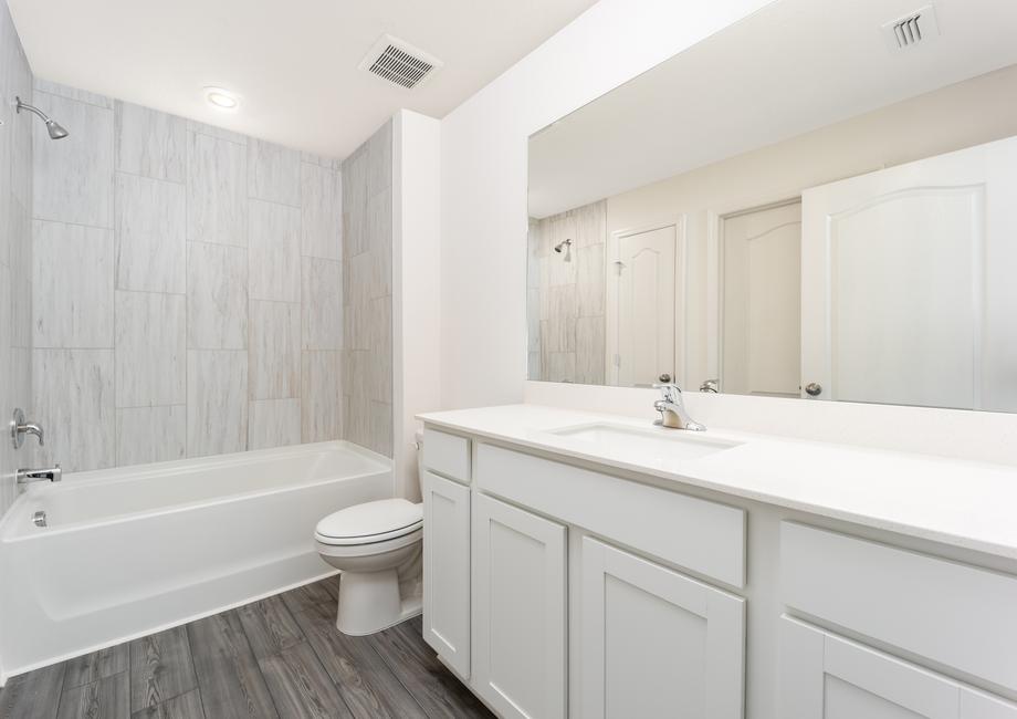 A spacious countertop awaits in the master bedroom