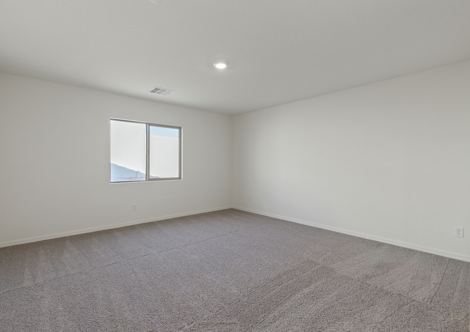 The master bedroom of the Castle has a large window that lets in great, natural light.