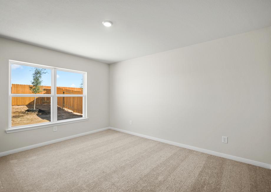 A spacious master bedroom with its own bathroom and walk-in closet.