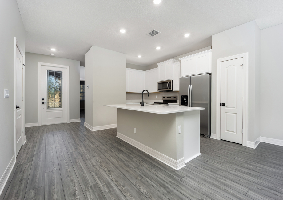 The kitchen opens up into the dining space