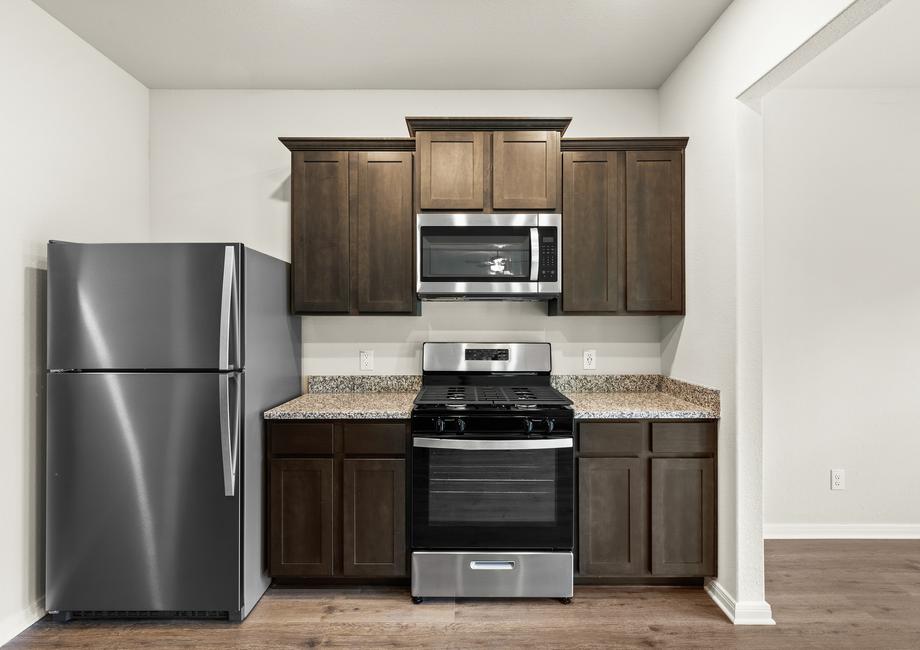 The kitchen of the Rayburn has gorgeous wood cabinetry.