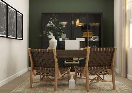 Rendering of the office showcasing a desk
  with two chairs. A cabinet with decorative pieces is behind the desk.