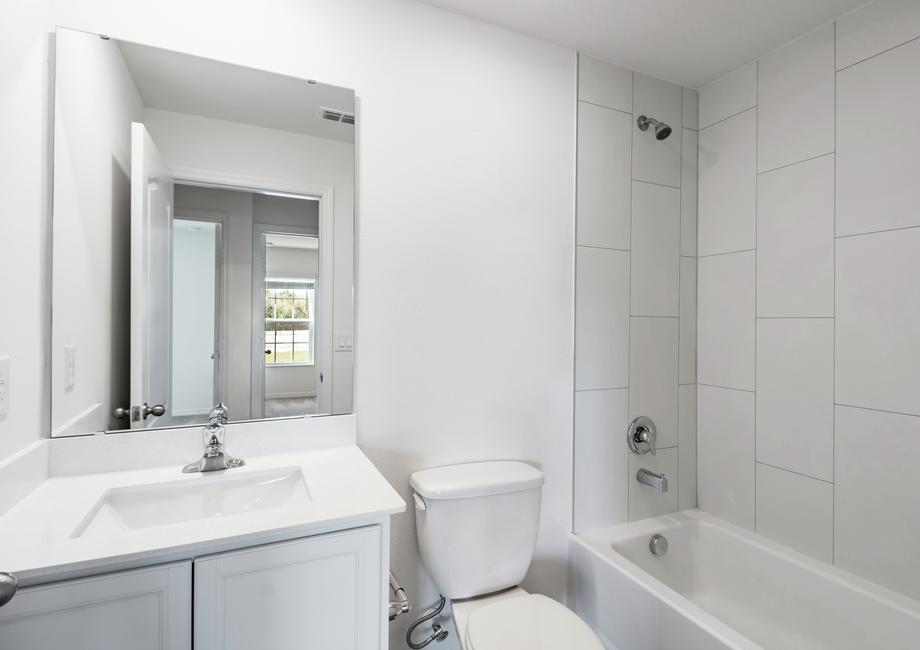 The guest bathroom has a spacious vanity ready for your guests