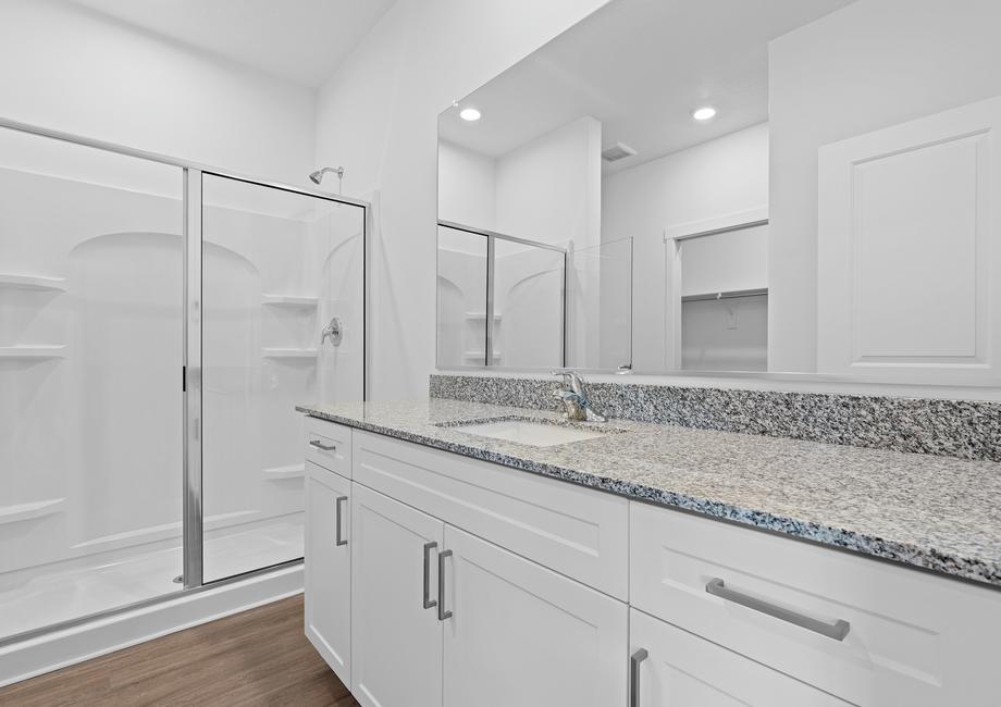 The beautiful master bathroom has plenty of space to get ready in the morning