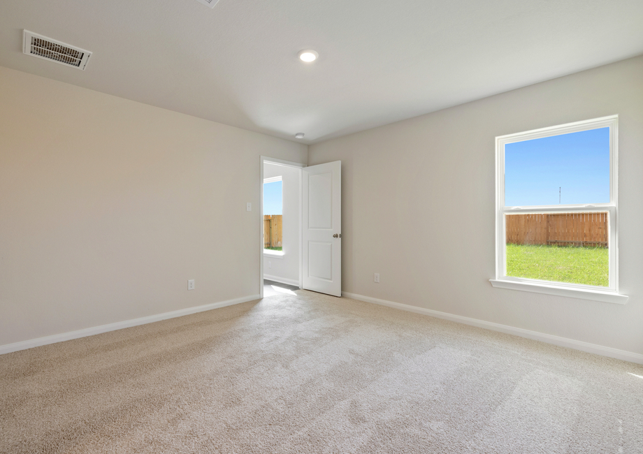 Master bedroom with a ceiling fan 