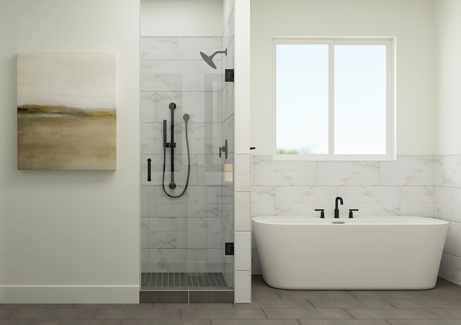 The master bathroom has a large soaker tub and glass, walk-in shower.