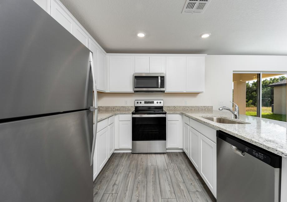 A kitchen filled with stainless steel appliances