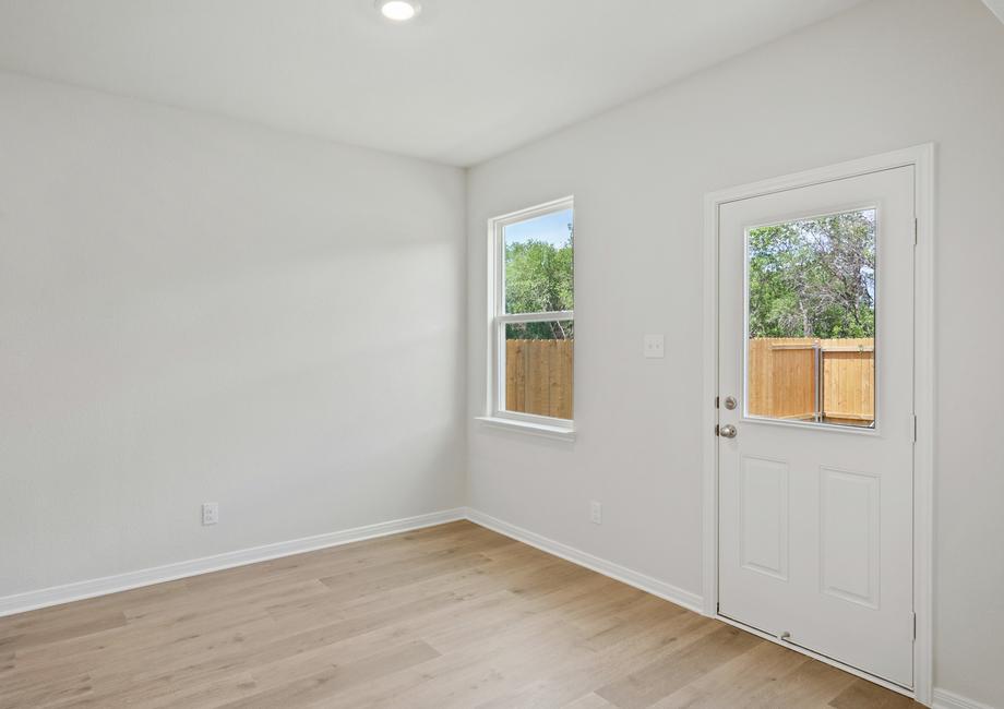 The dining room has two large windows that let in great, natural light and backyard views.