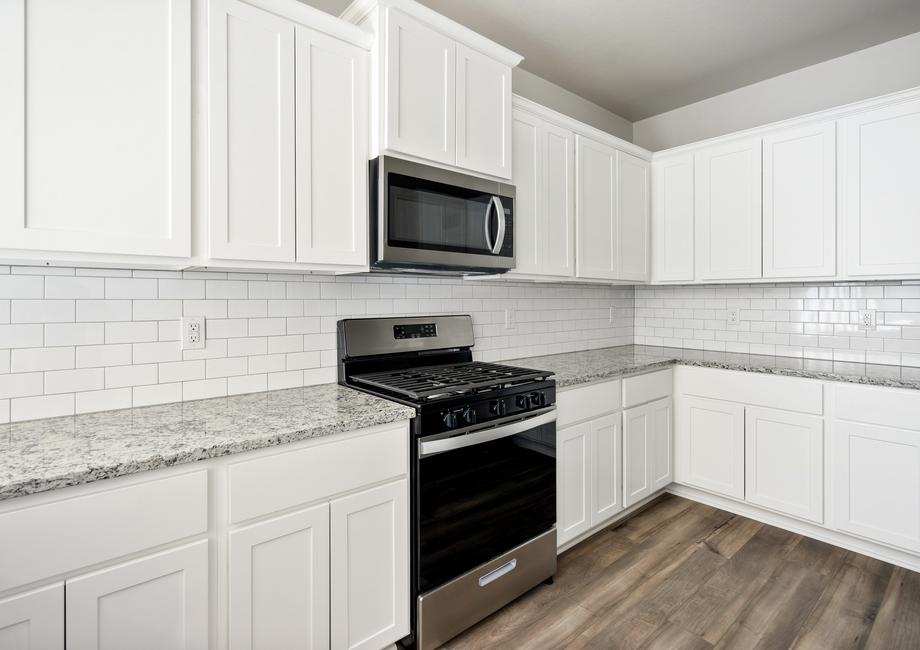 The kitchen of the Sudan has beautiful white wood cabinets.