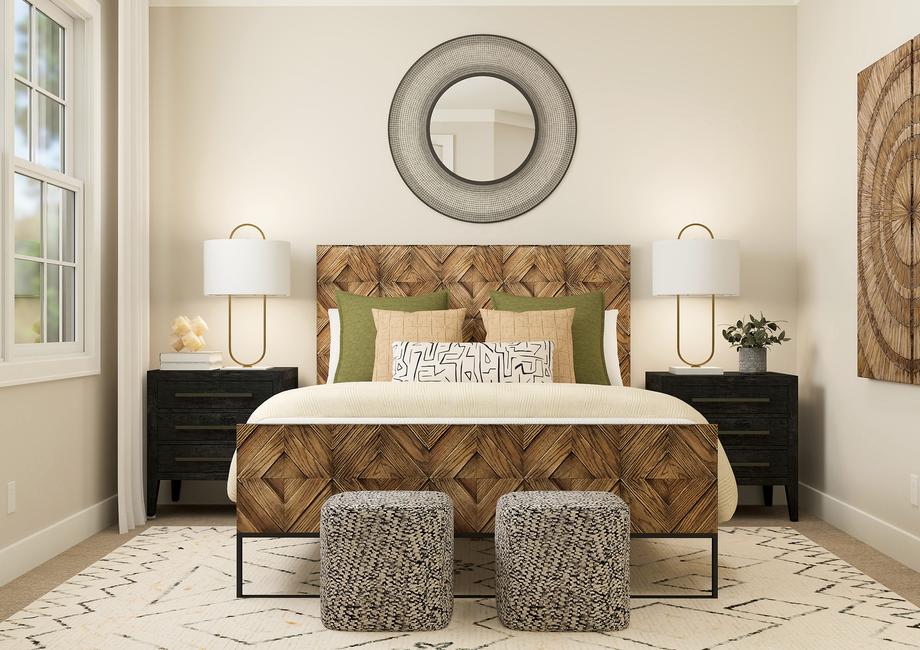Rendering of a bedroom furnished with a
  large bed in between to dark side tables. This room is also furnished with
  wall dÃ©cor and two poufs at the end of the bed.Â 