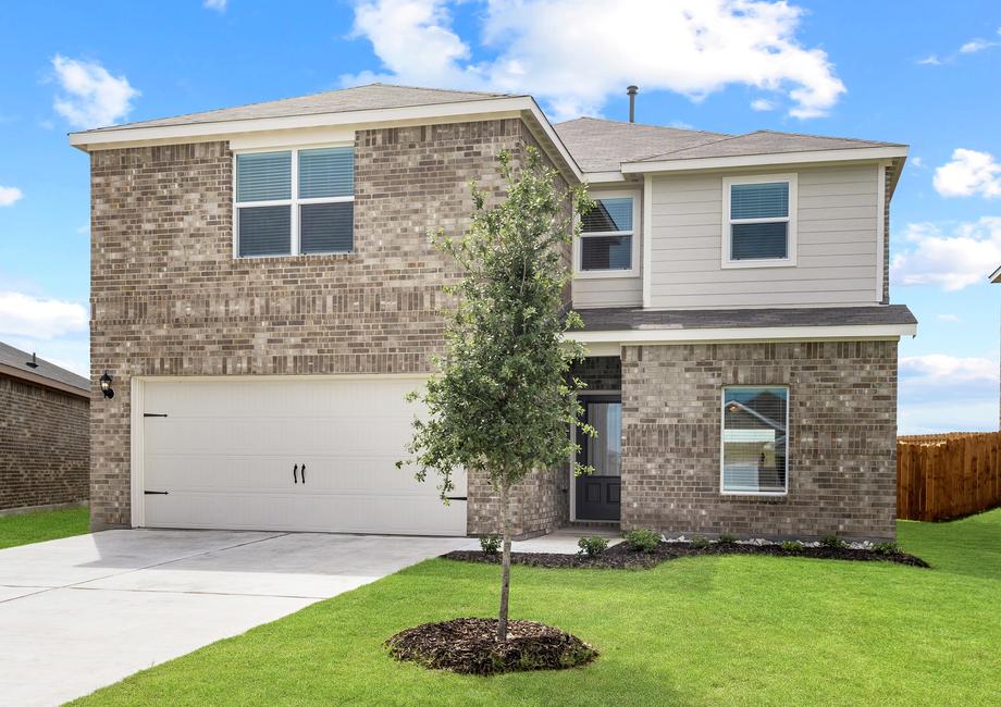 The Driftwood is a beautiful two-story, brick home with siding details.