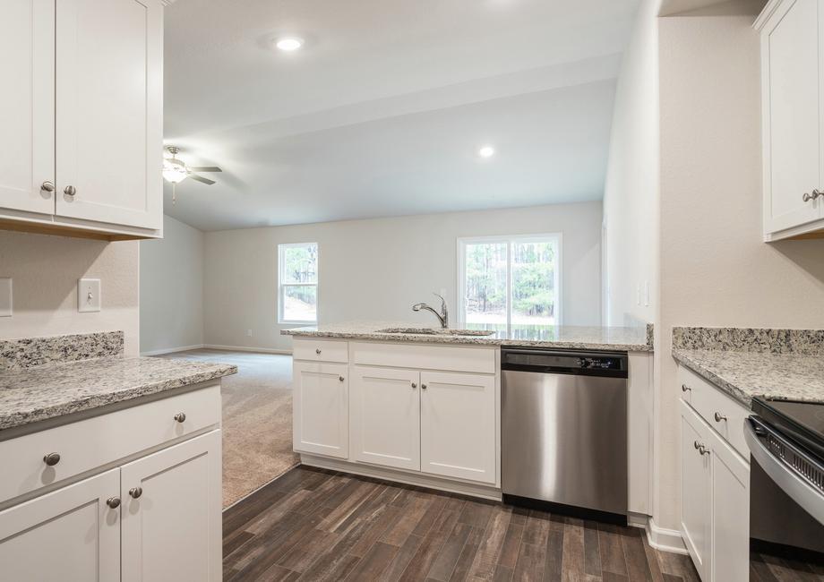 The kitchen has a lot of cabinet space for storage.