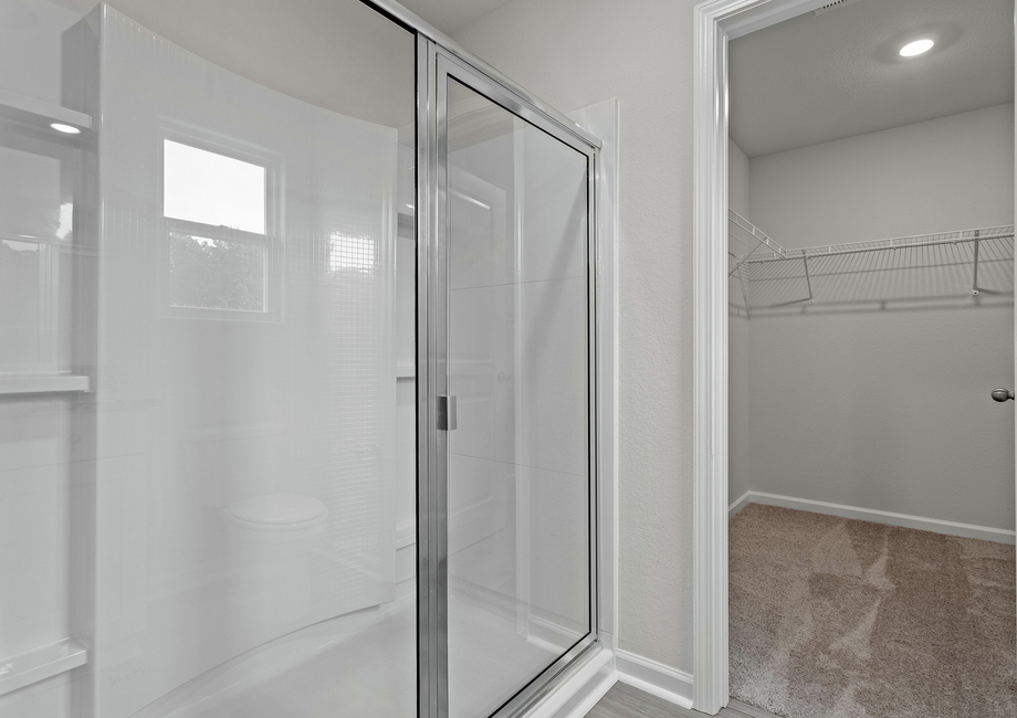 This bathroom has a glass-enclosed shower.