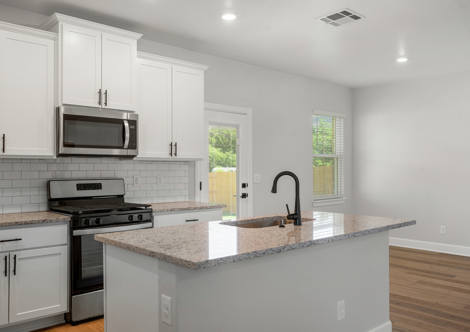 The kitchen sits adjacent to the dining room.