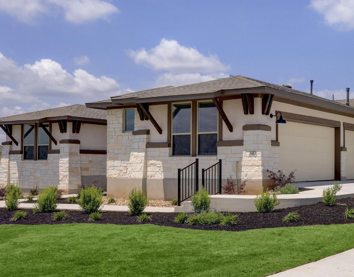 Angled exterior of the Hampton plan with a side-load three-car garage.