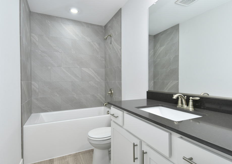 The secondary bathroom has a tub/shower combo.