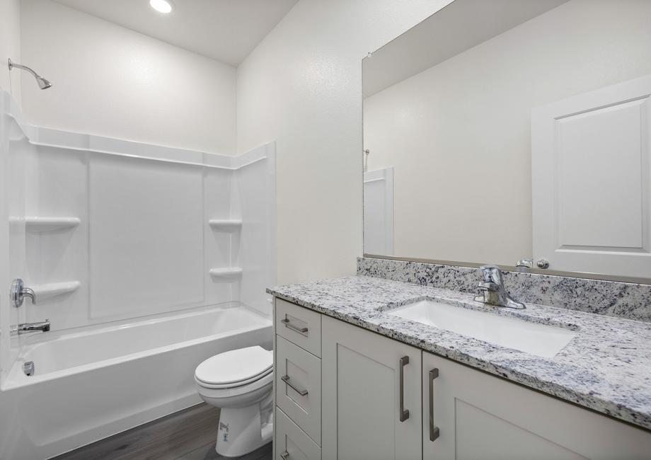 The secondary bathroom has a tub/shower combo.