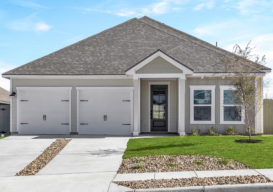 The Kendall displaying an elegant grey and white exterior with separated garage doors.