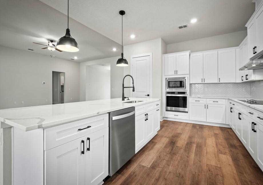 Stainless steel appliances are included in the fully loaded kitchen.