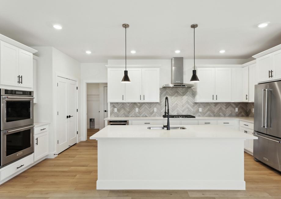 The kitchen has a wonderful island with quartz countertops.