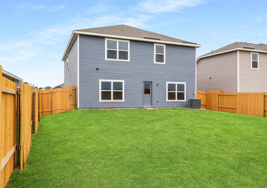 The back yard of the Driftwood is a fully fenced-in.