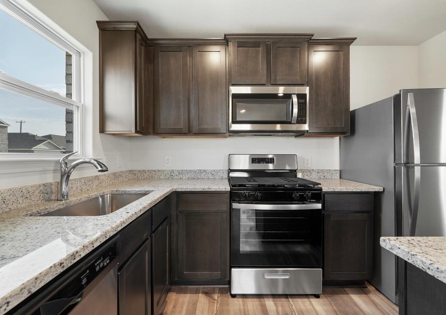 The kitchen of the Sabine has sprawling granite countertops.