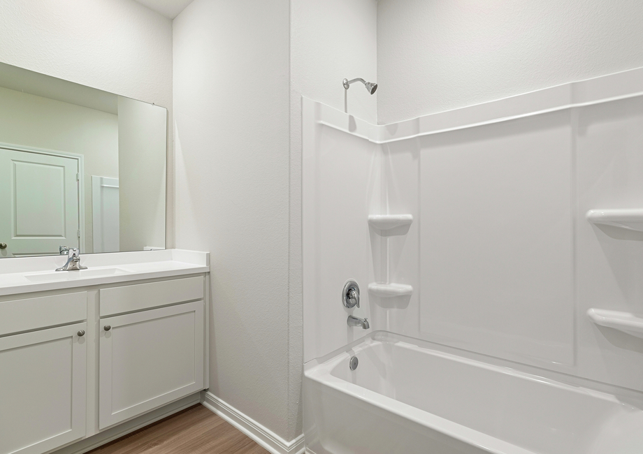 A spacious secondary bathroom