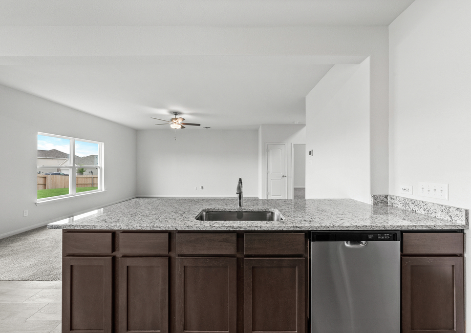 The kitchen of the Cypress sits adjacent to the family room.