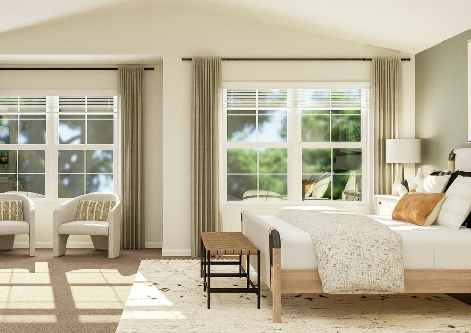 Rendering of the spacious master suite in
  the Burke, looking towards the two large windows. The room has a vaulted
  ceiling and carpeted flooring. A bed is opposite a dresser and a sitting area
  is in-between.