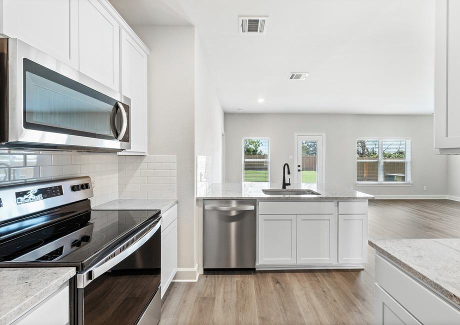 The kitchen of the Rio Grande has gorgeous white wood cabinetry.