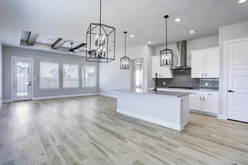 Bright, open layout with the kitchen, dining area, and living room connected.