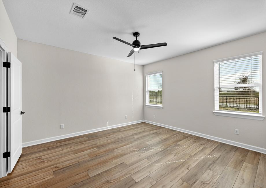 The master bedroom has luxury vinyl plank flooring.