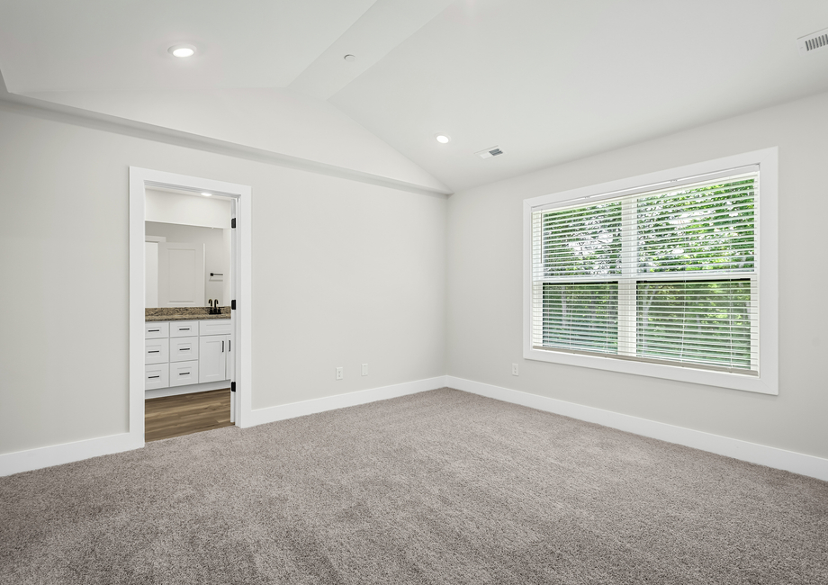 Unwind in the primary bedroom after a logn day