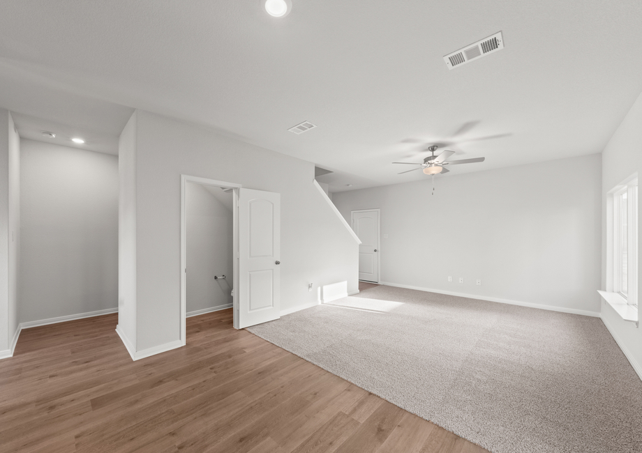 The powder room sits right off of the family room.