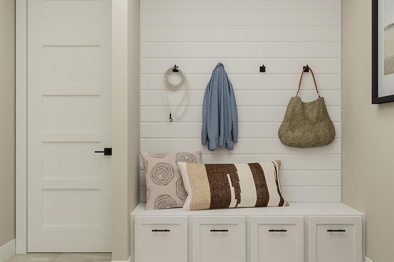 Rendering of the mud room showing white
  cabinetry and built-in bench with beige walls and tiled flooring throughout.