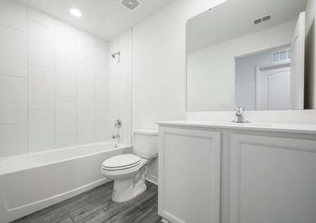 The guest bathroom has a large vanity and is ready for your guests