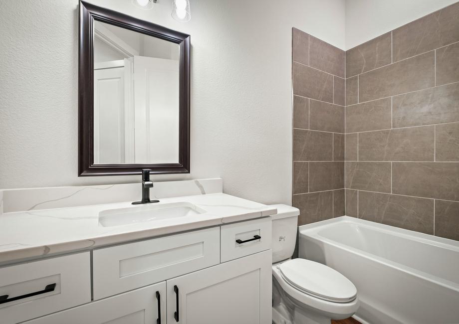 Matte black hardware is already on the gorgeous white cabinets.