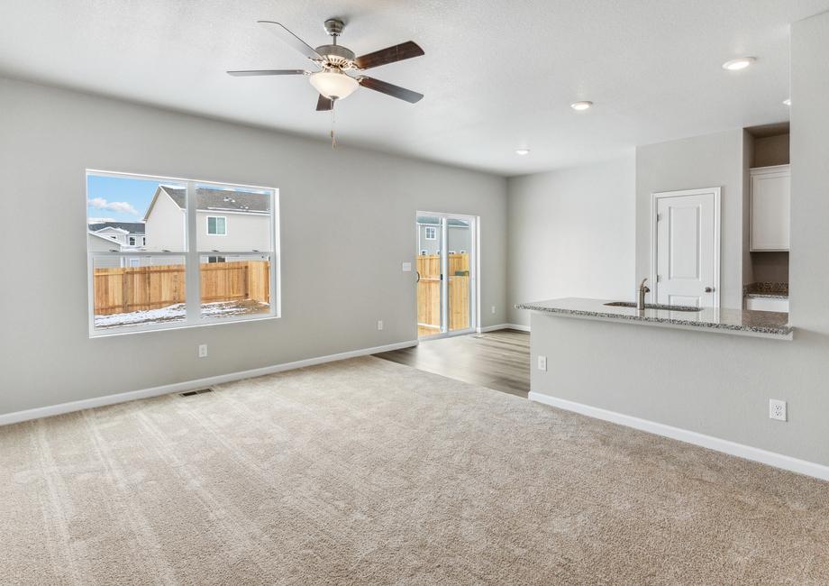 Open layout with the kitchen overlooking the living room and dining area.