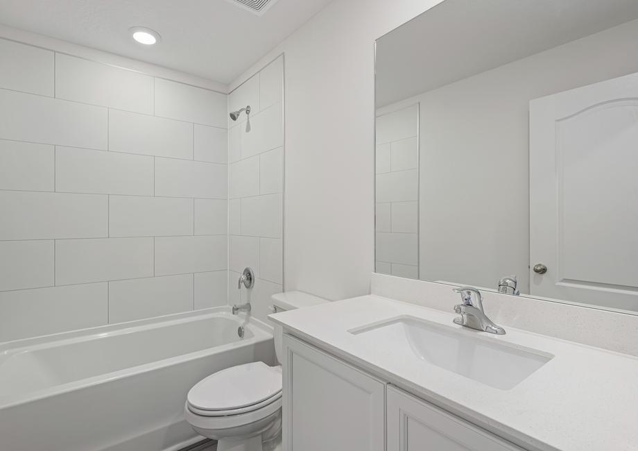 The spare bathroom has a large vanity ready for you guests to get ready at