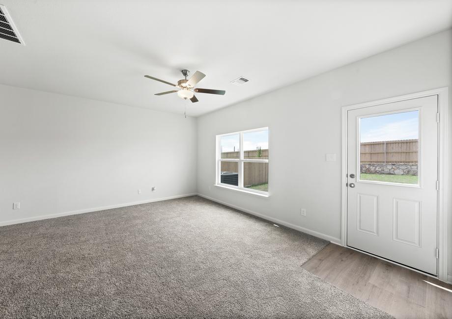 The family room of the Driftwood has a large window that lets in great natural light and backyard views.