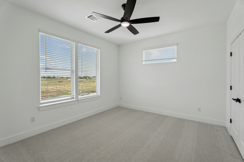 Cozy secondary bedrooms are found throughout the home.