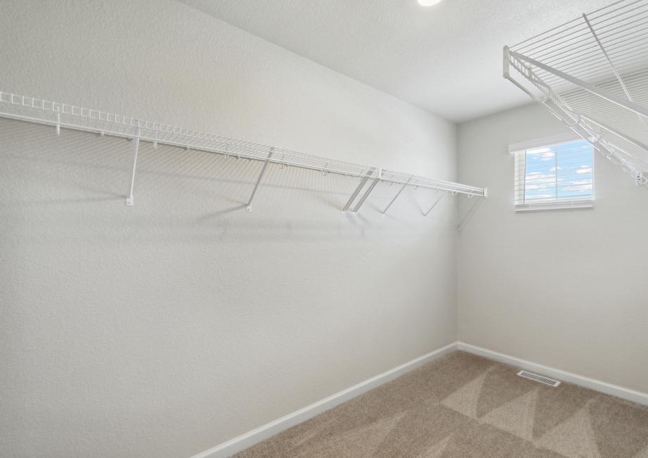 The walk-in, master closet is large and equipped to meet all of your storage needs.