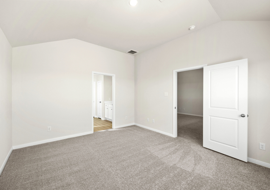 The master suite has a spacious bedroom, en-suite bathroom and walk-in closet.